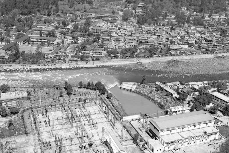 Challenges Impacting the Connection between Water and Religion - River Bhagirathi emerging after a tunnelled stretch at Tiloth Power House in Uttarkashi, Uttarakhand